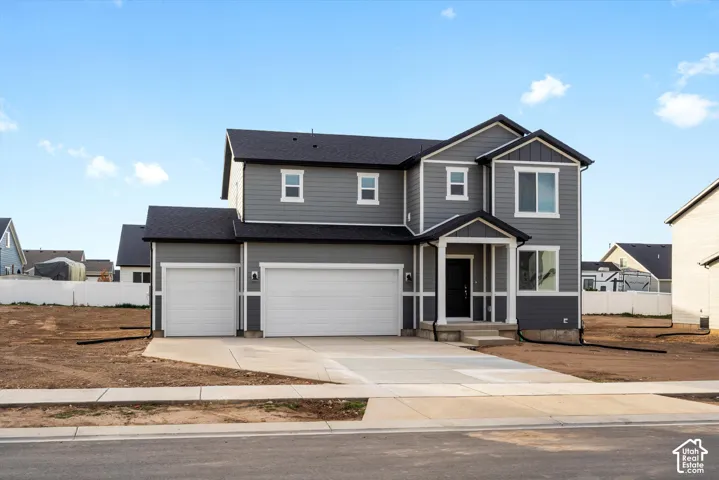 **DISCLAIMER** Elevation may vary. Two-story exterior featuring gray horizontal siding, white trim, a three-car garage, and a covered front porch entryway