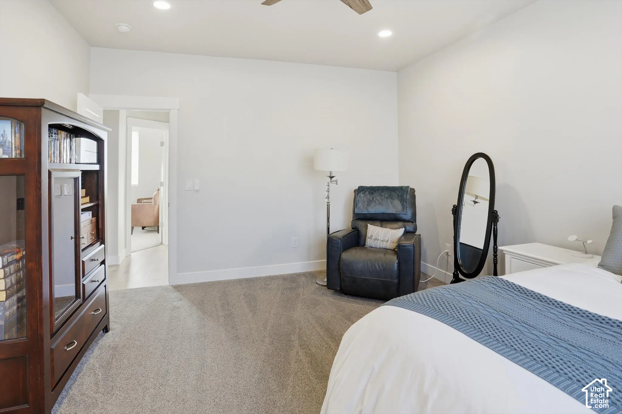 Room featuring neutral wall tones, carpeted flooring, recessed lighting, and a ceiling fan