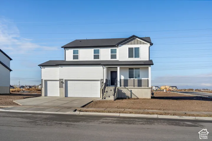 Two-story residence featuring a white horizontal siding exterior, gray shingle roof, attached three-car garage, and a covered front porch with metal railing
