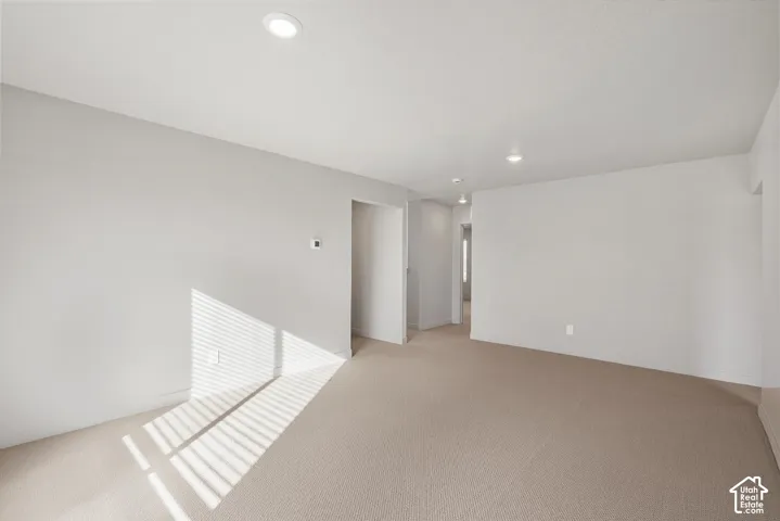 *DISCLAIMER* Interior color package may vary. Neutral-toned interior featuring wall-to-wall carpeting, recessed ceiling lighting, and crisp, minimalist wall finishes