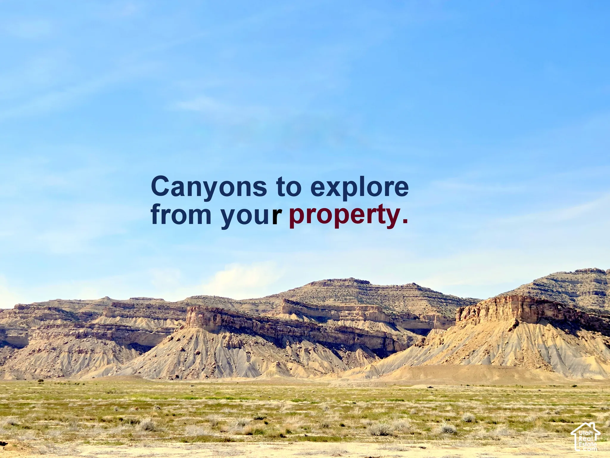 Expansive terrain featuring natural rock formations and prominent canyon topography