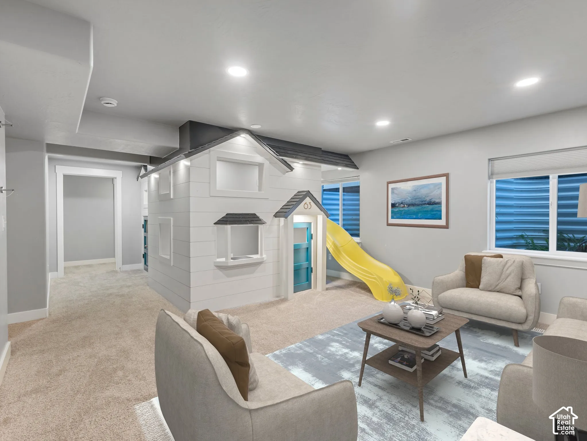 Neutral-toned interior featuring recessed lighting, carpeting, and a built-in architectural play structure with a slide