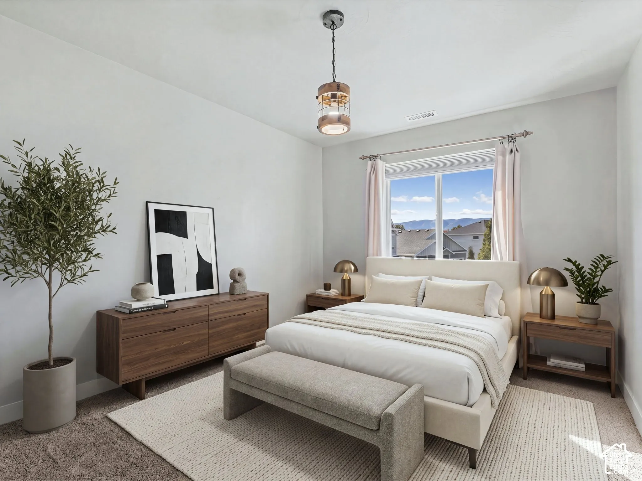 Neutral-toned room featuring wall-to-wall carpeting, an industrial-style metal and wood pendant light, and a large window with mountainous exterior scenery