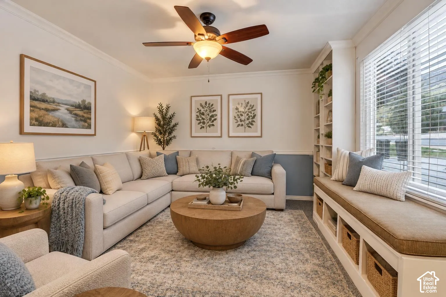 Built-in floor-to-ceiling shelving, custom window seat with lower storage cubbies, ceiling fan with integrated lighting, and horizontal window blinds