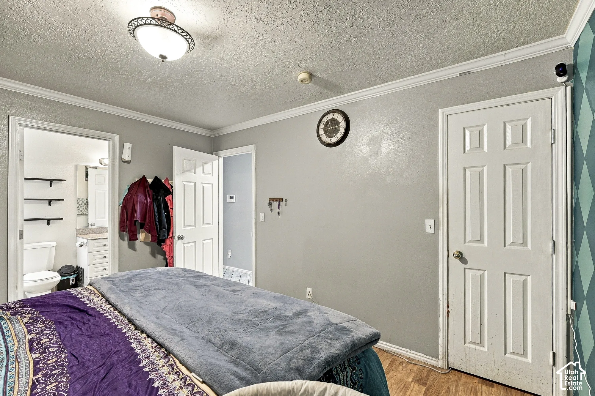 Interior space featuring crown molding, neutral wall finishes, multi-panel doors, and overhead semi-flush mount lighting