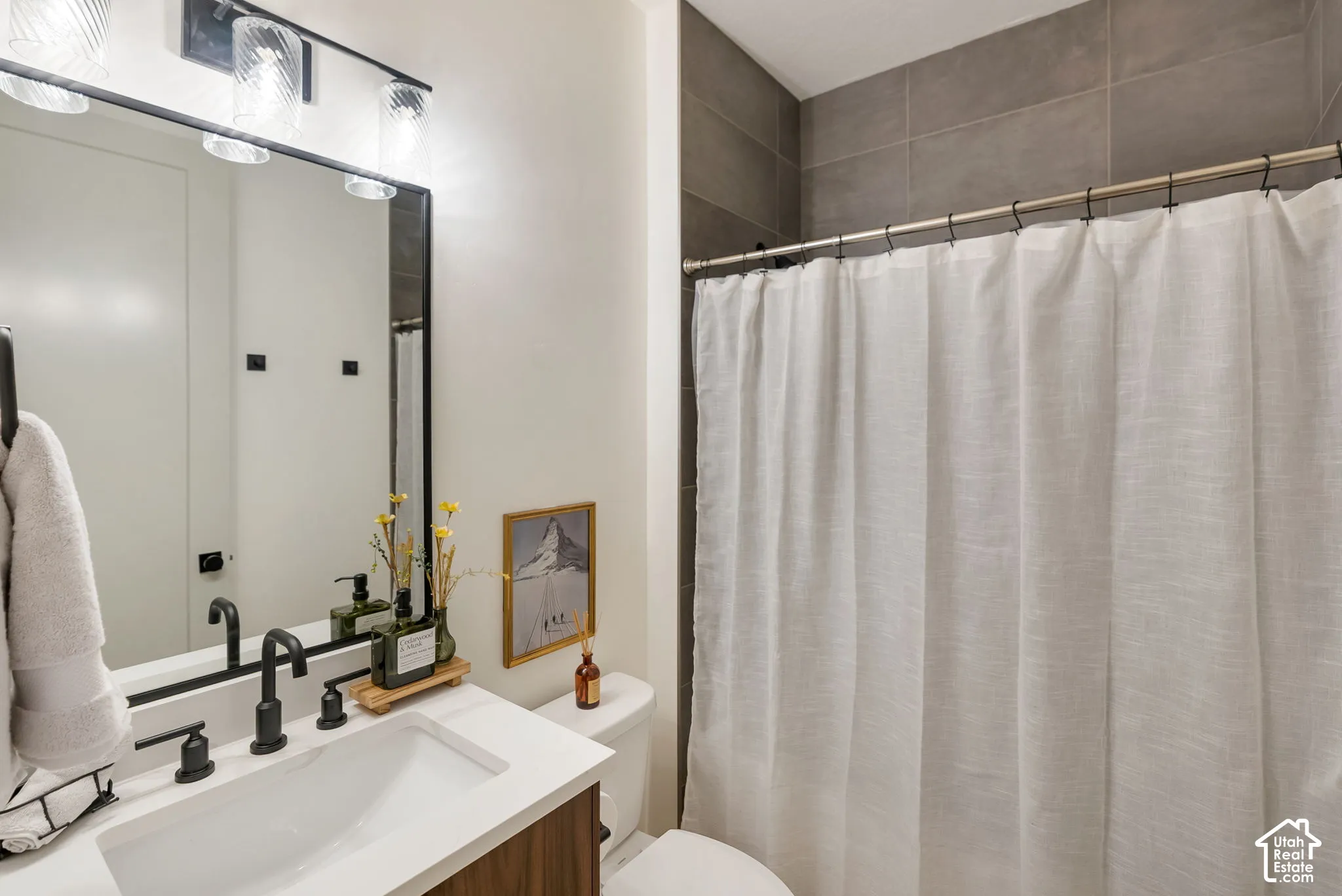 Bathroom featuring a wood-finish vanity