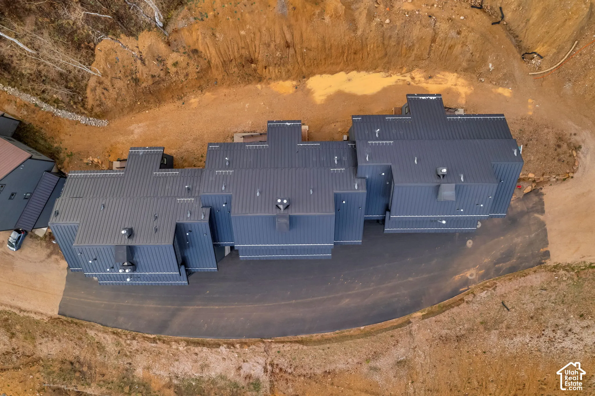Aerial perspective of a mountain-side property with ski access in 4 directions