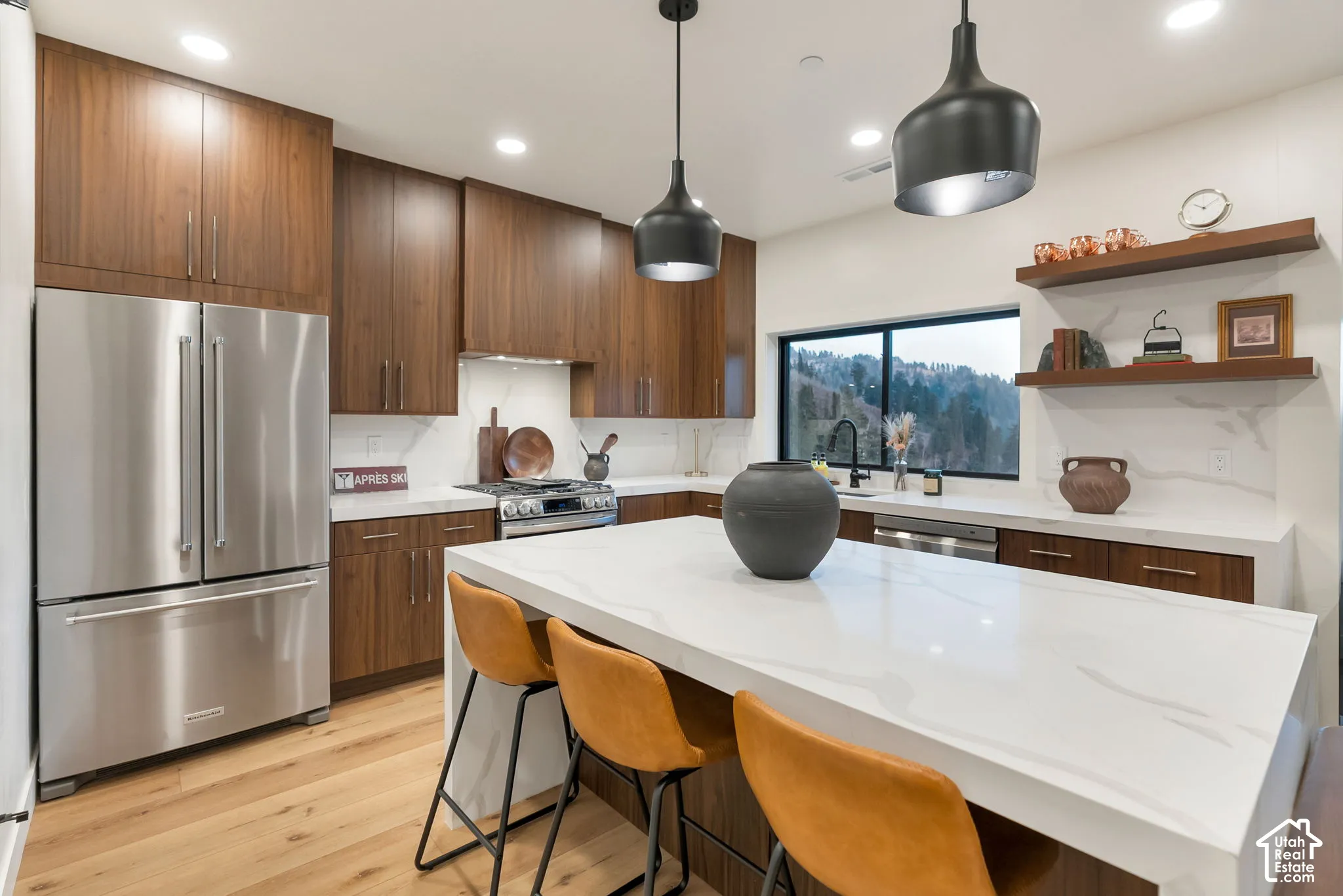 Kitchen featuring flat-panel wood cabinetry