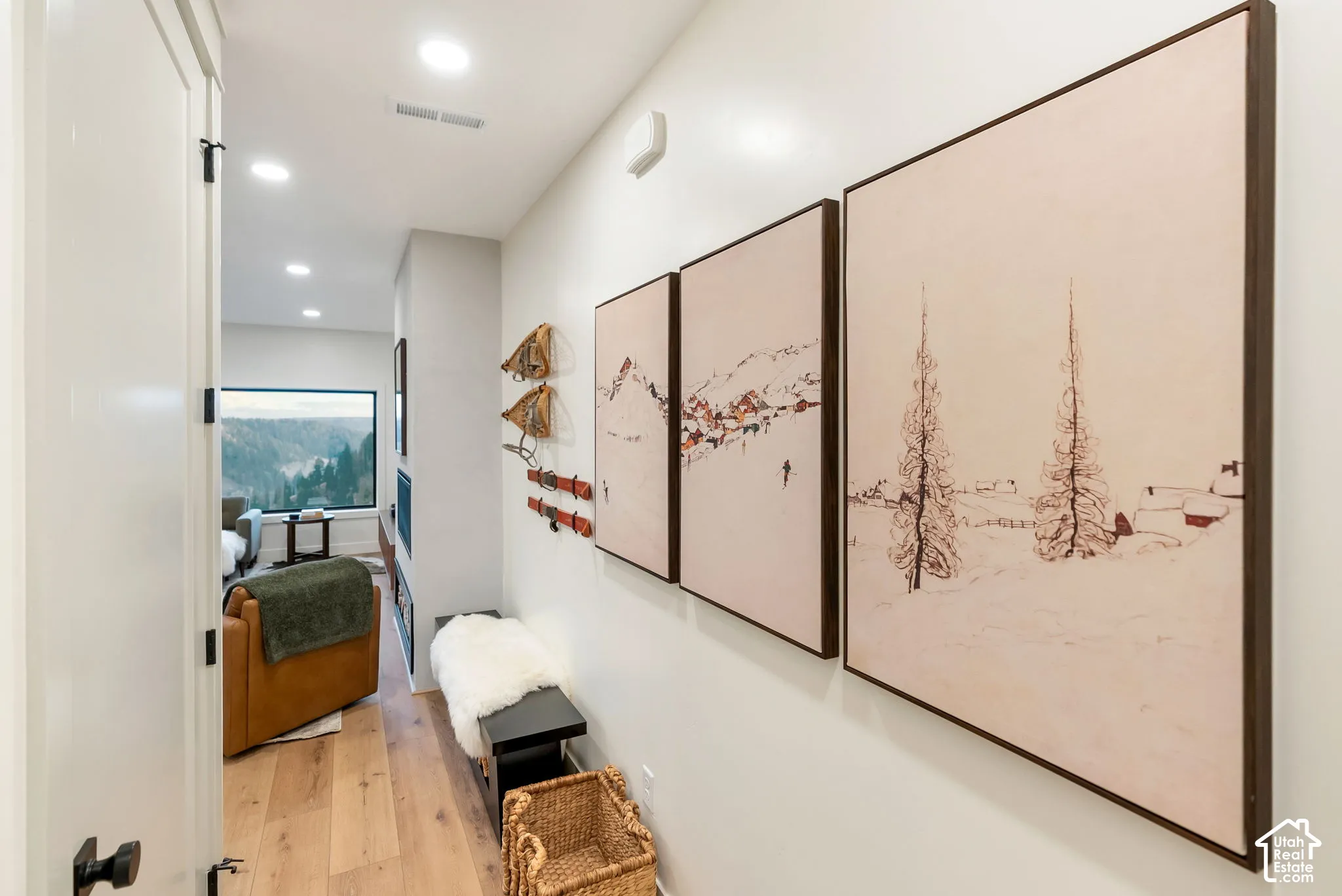 Hallway featuring wood-finish flooring, recessed lighting, and expansive window with mountain scenery
