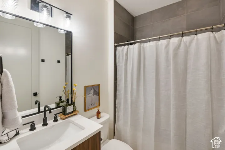 Bathroom featuring a wood-finish vanity