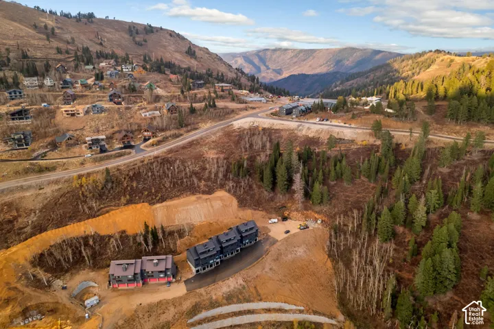 Aerial perspective of a mountain-side property with ski access in 4 directions