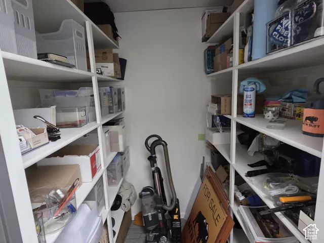 Built-in floor-to-ceiling white shelving units