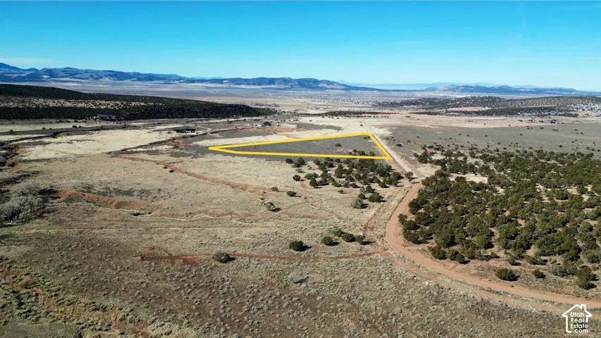 Vacant parcel featuring native high-desert vegetation, unimproved terrain, and expansive mountain scenery