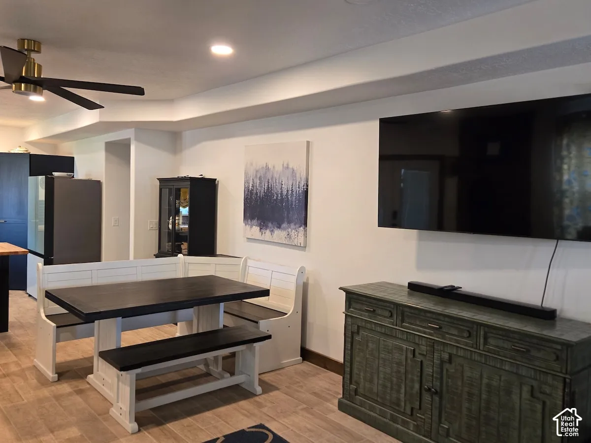 Wood-finish flooring, recessed lighting, and a modern ceiling fan