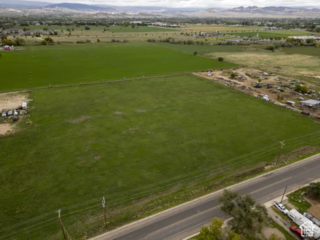 Expansive open acreage featuring level terrain and mountain range horizon