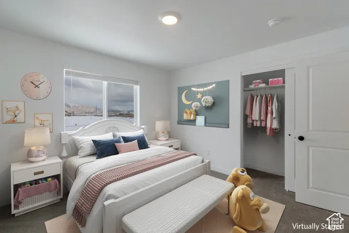 Room featuring neutral wall tones, carpeted flooring, a sliding-panel closet door, and a single-hung window