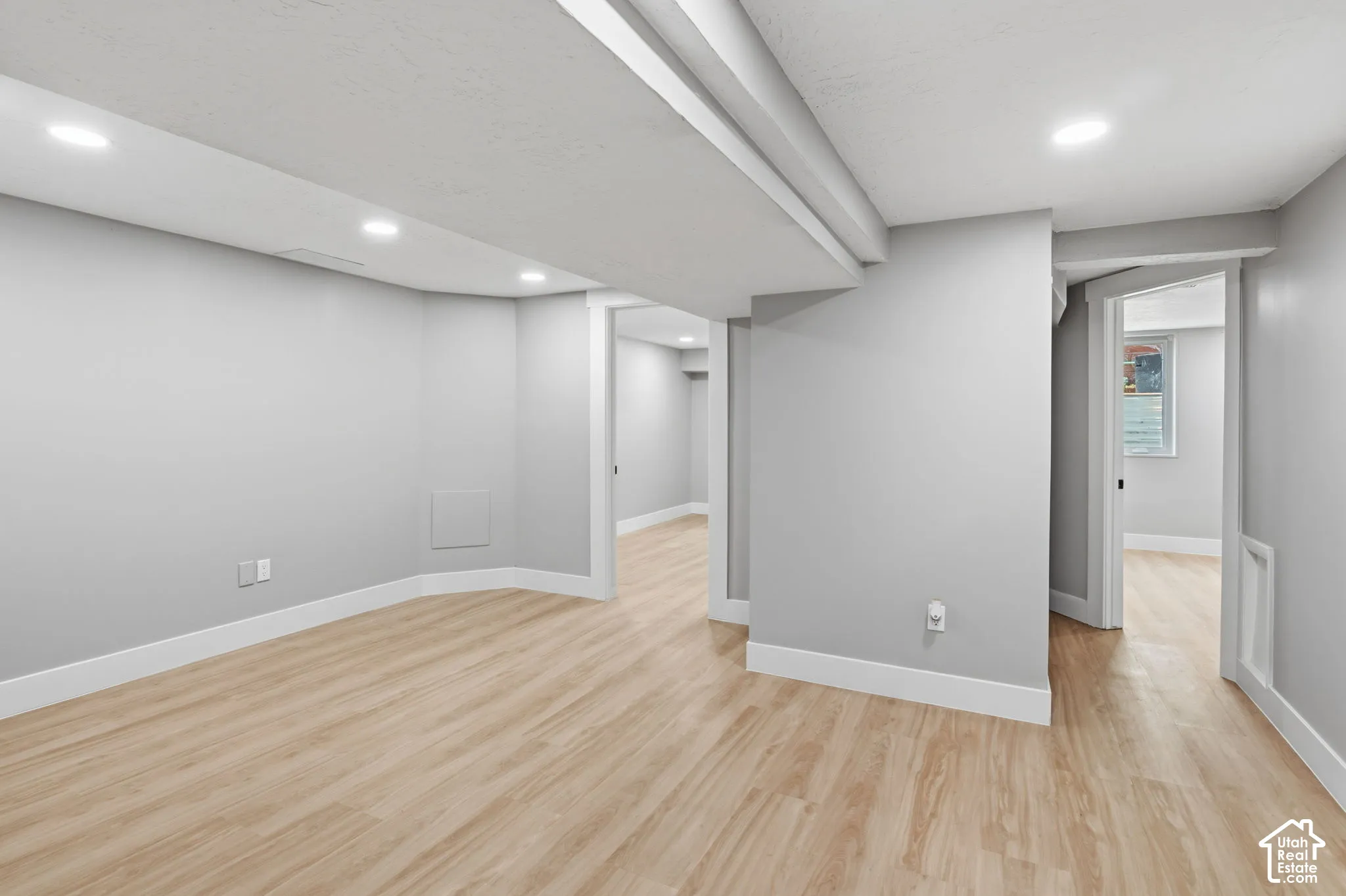 Interior space featuring wood-finish flooring, recessed lighting, and neutral wall paint