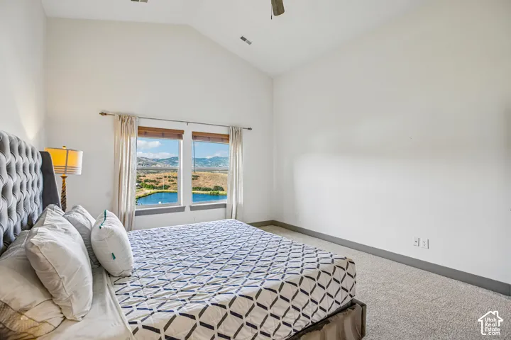 Vaulted ceilings, carpeting, dual windows, and mountain and water scenery