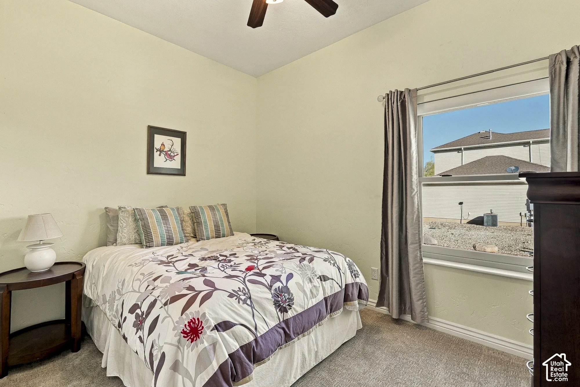 Room featuring neutral wall tones, wall-to-wall carpeting, and a ceiling fan with integrated lighting