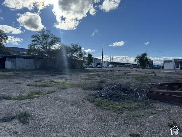 Expansive level lot featuring gravel surface and mature trees