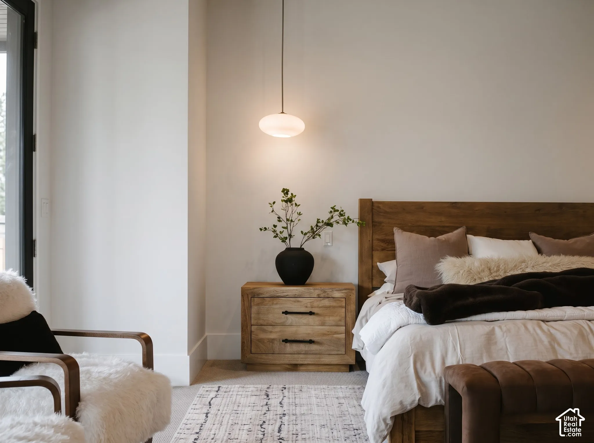 Primary Bedroom Featuring Edward Martin pendant lighting