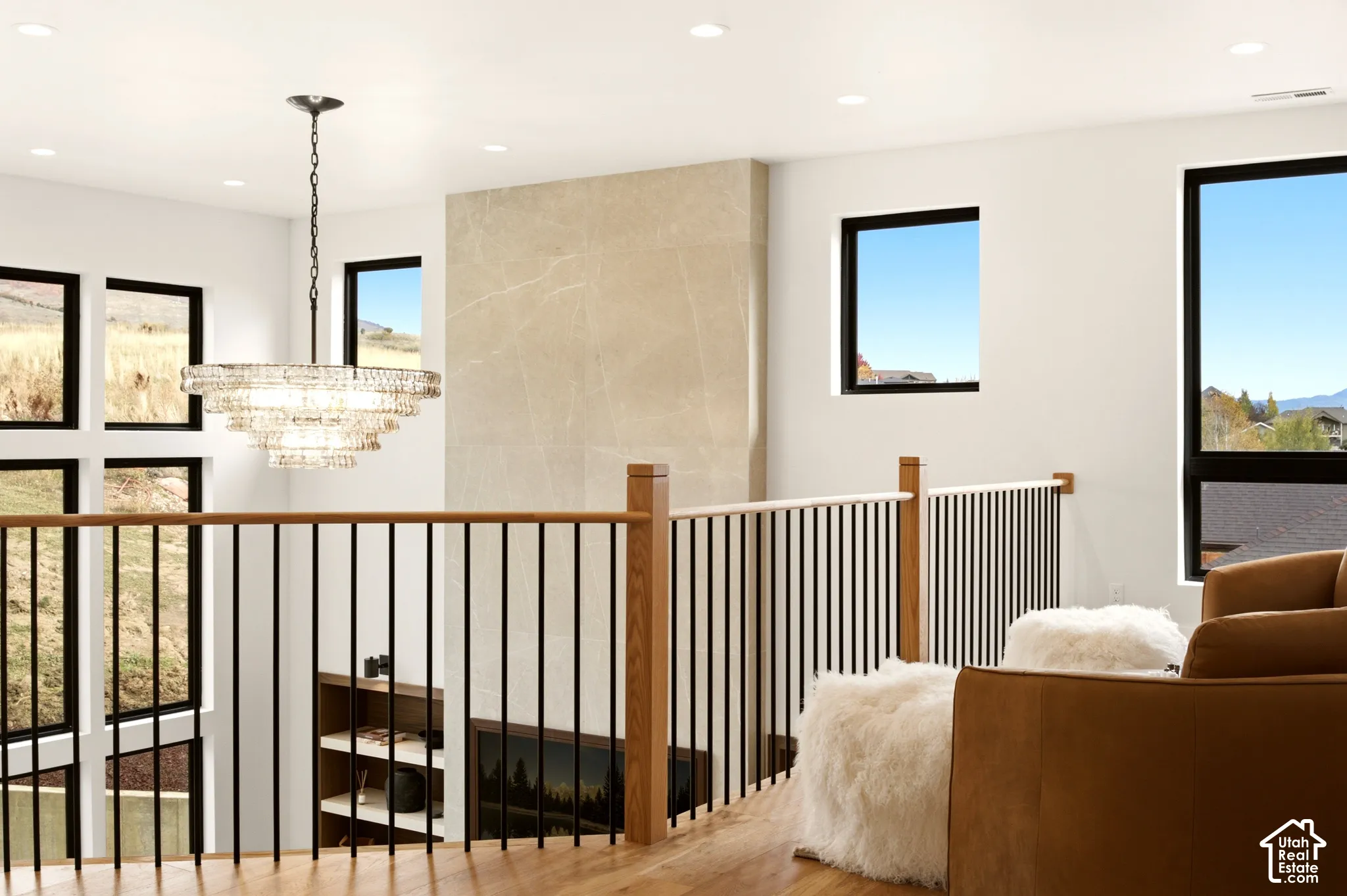 intimate sitting area overlooking the great room with mountain views