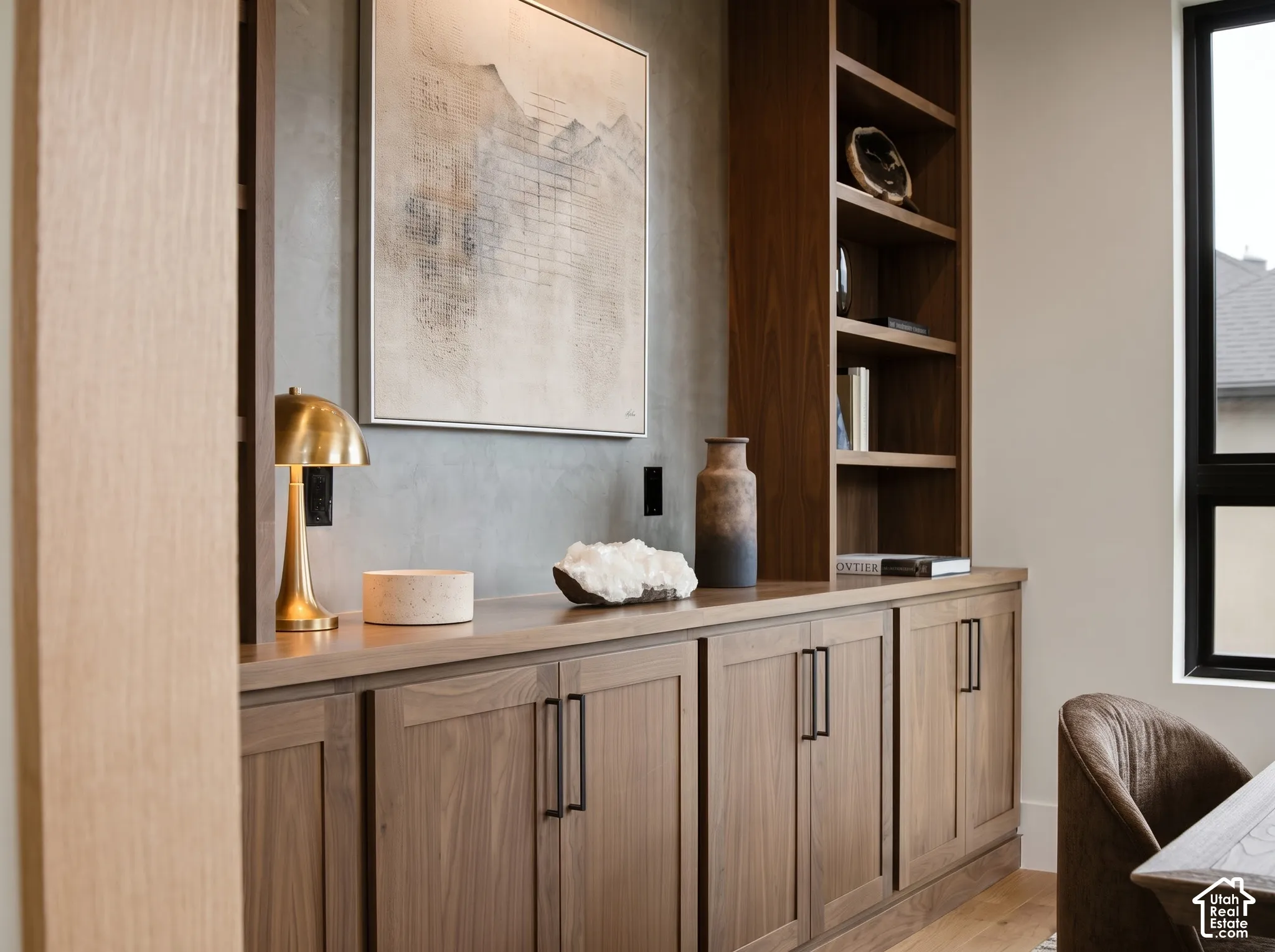 Beautiful built-in floor-to-ceiling walnut cabinetry with shaker-style doors, integrated open shelving, Roman Clay plaster accent wall, and ash grey hardware