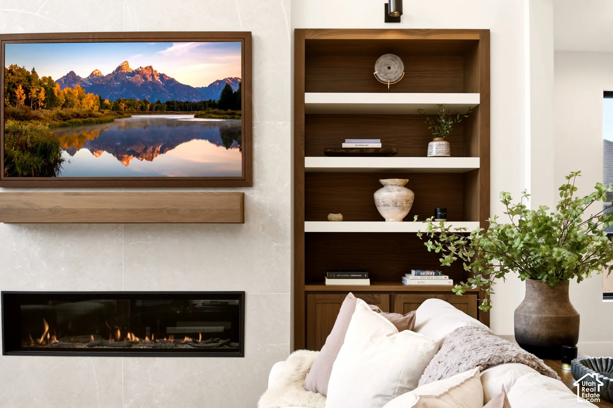 "Montego" 63" Linear gas fireplace with tile surround, Walnut mantel, and built-in Walnut shelving with integrated lighting