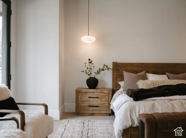 Primary Bedroom Featuring Edward Martin pendant lighting