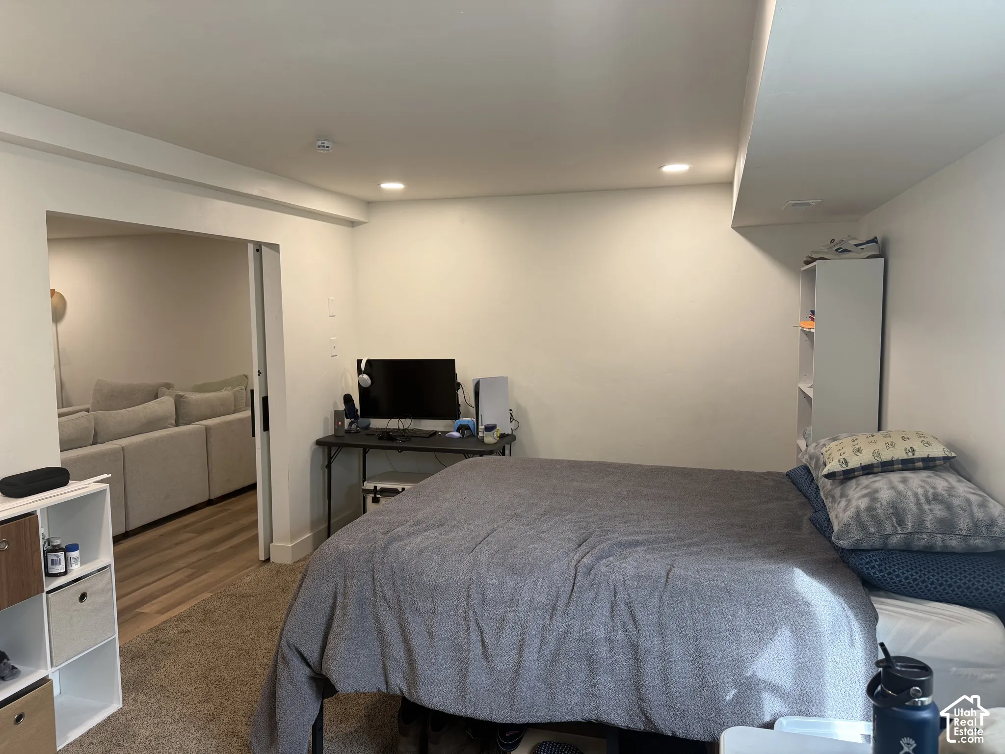 Interior room featuring recessed ceiling lighting, wall-to-wall carpeting, and a sliding door entry