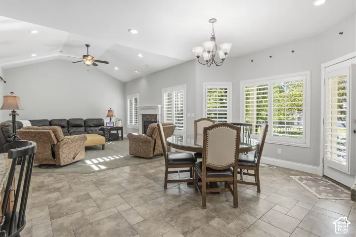 Vaulted ceilings, tile flooring, recessed lighting, fireplace with mantel, and plantation shutters
