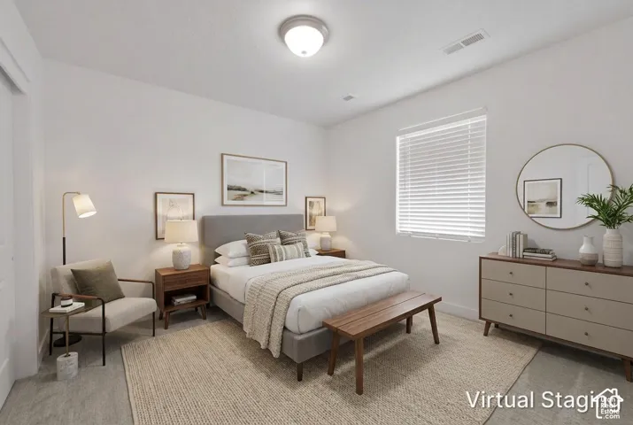 Neutral wall palette, ceiling-mounted light fixture, and horizontal blind window treatment
