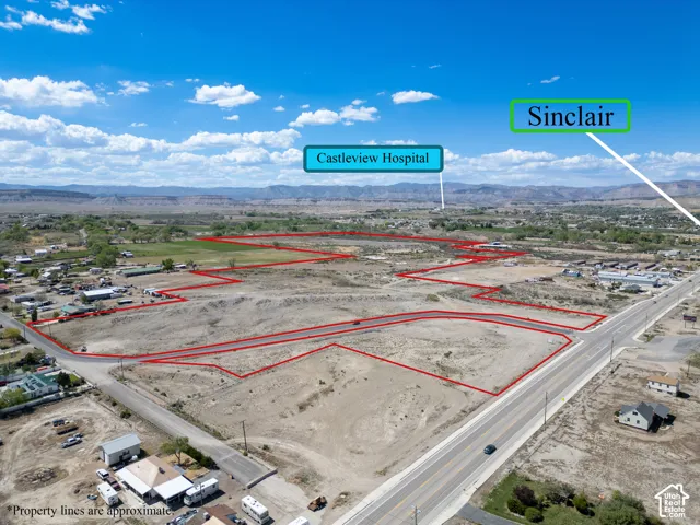 Expansive acreage featuring prominent road frontage and mountain silhouettes