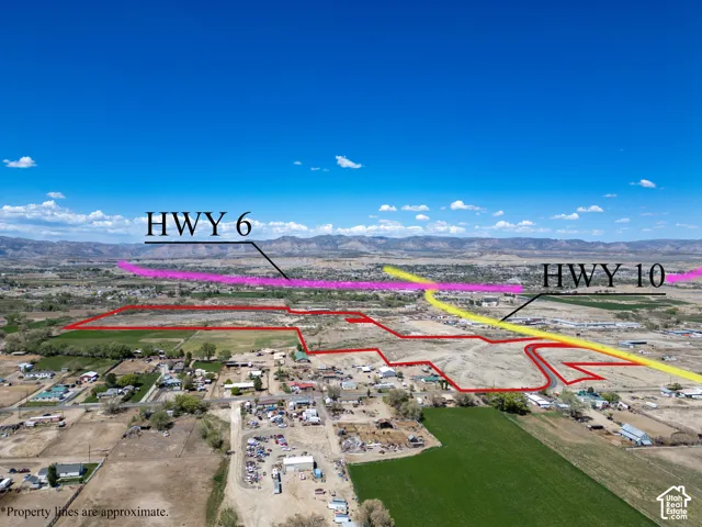 Aerial perspective of expansive acreage featuring mountain surroundings and proximity to major thoroughfares