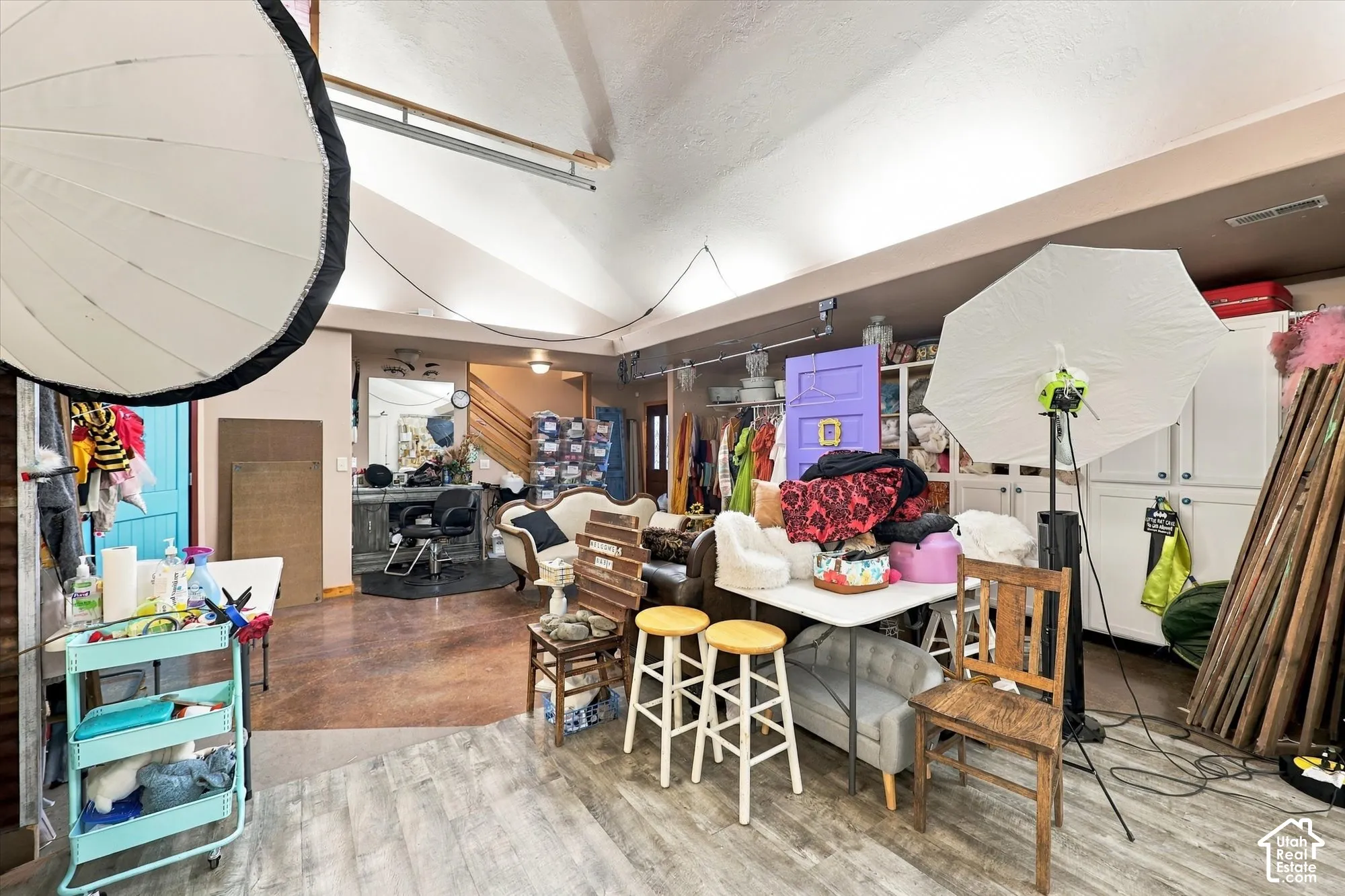 Vaulted ceilings, built-in cabinetry, and wood-finish flooring