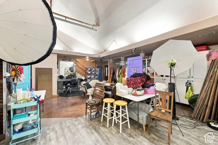 Vaulted ceilings, built-in cabinetry, and wood-finish flooring