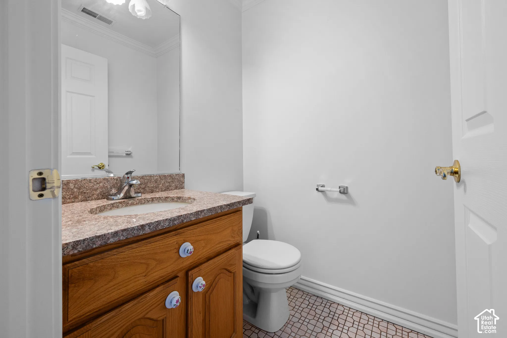 Half bath featuring vanity and full-height wall mirror