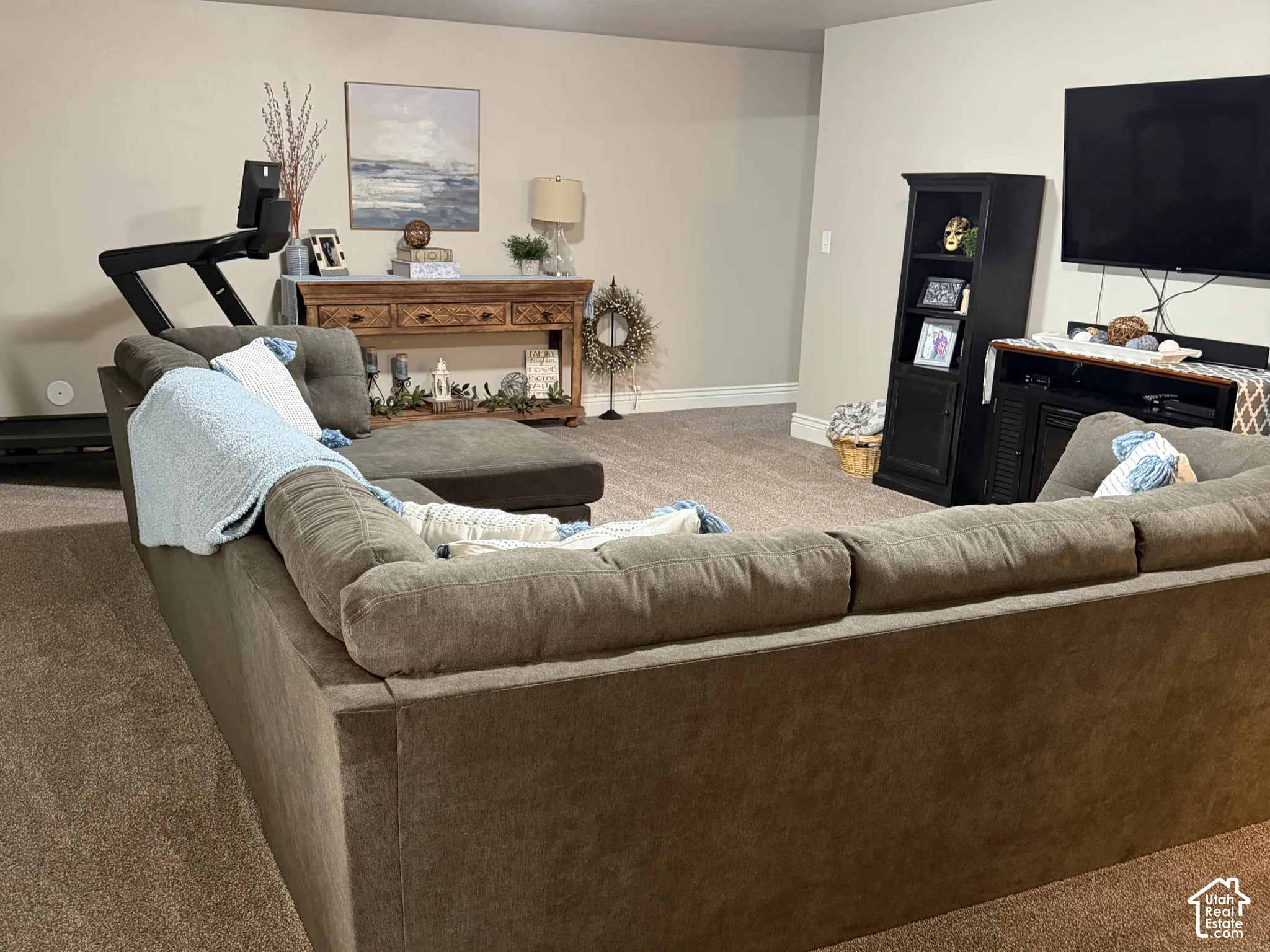 Spacious interior featuring neutral-tone carpeting and dual flush-mount ceiling lighting