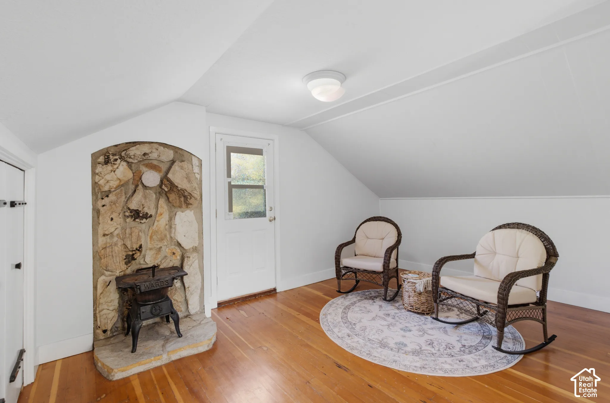Reading nook in the primary bedroom with a door going to the balcony