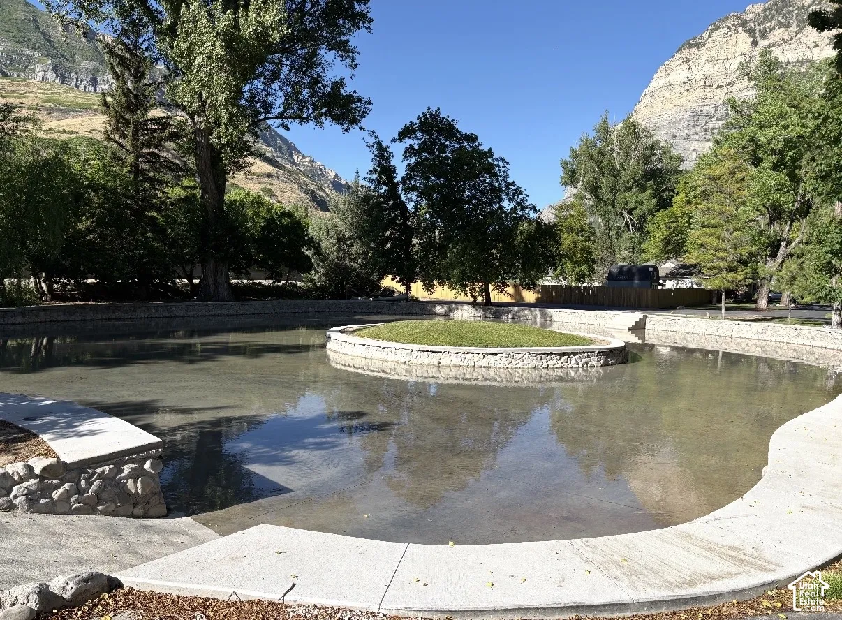 Concrete-lined pond that is filled in for the warm season