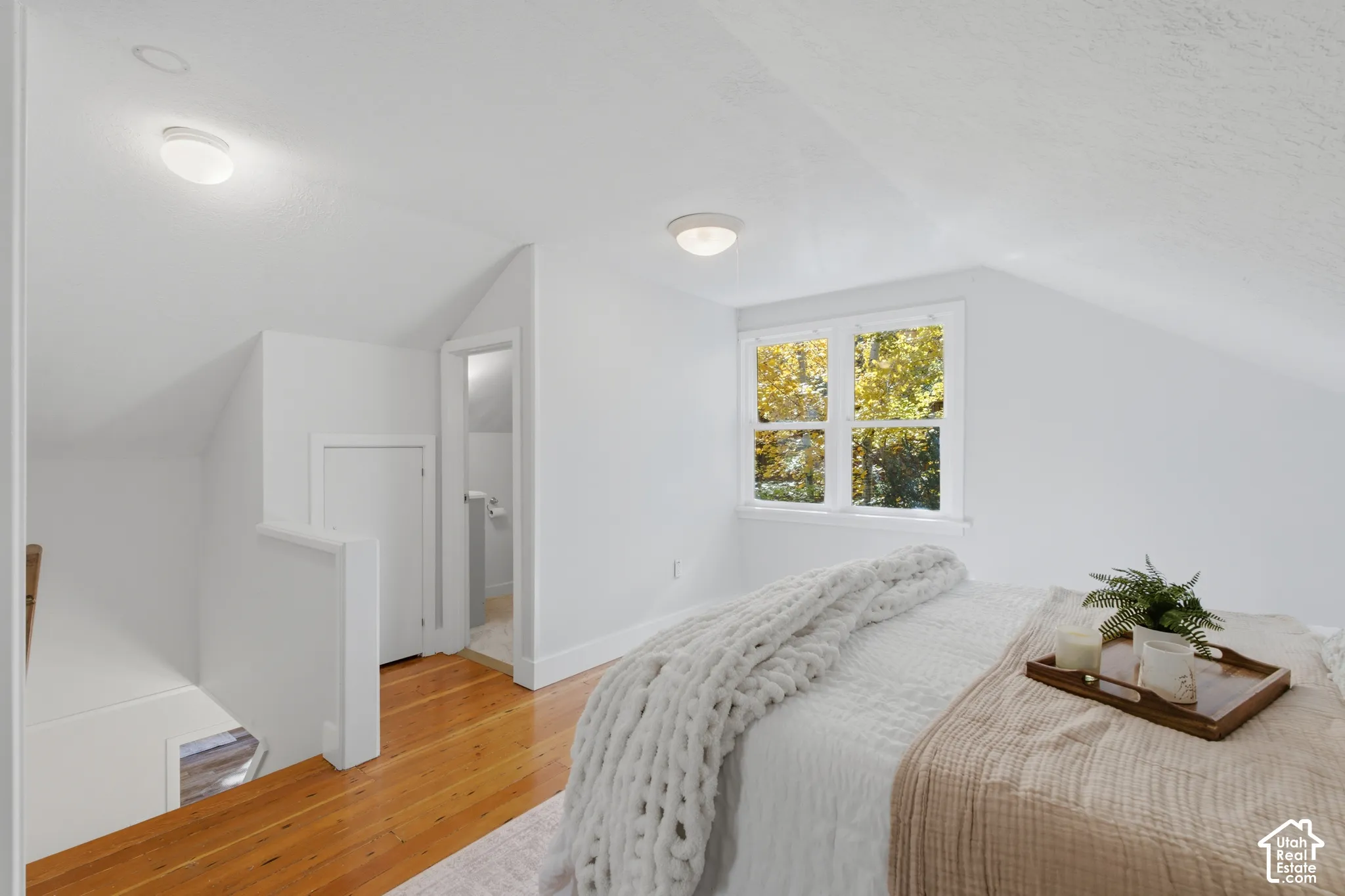 Primary bedroom with a window