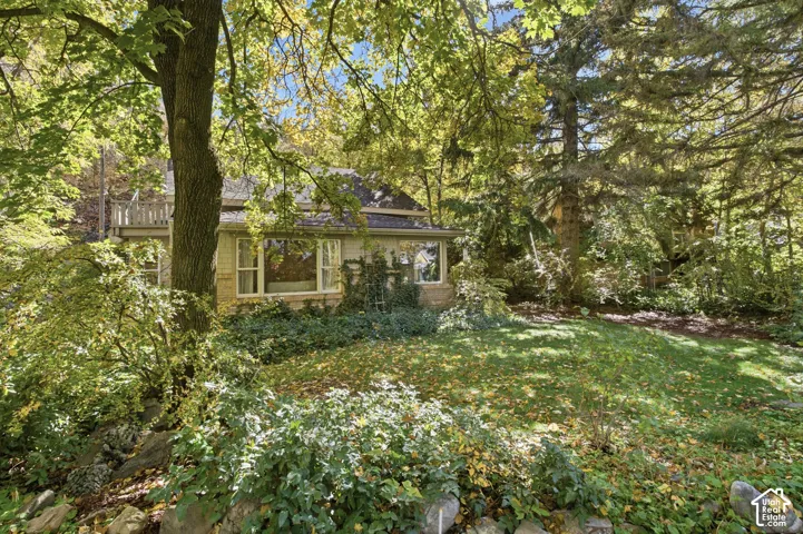 Exterior with established landscaping