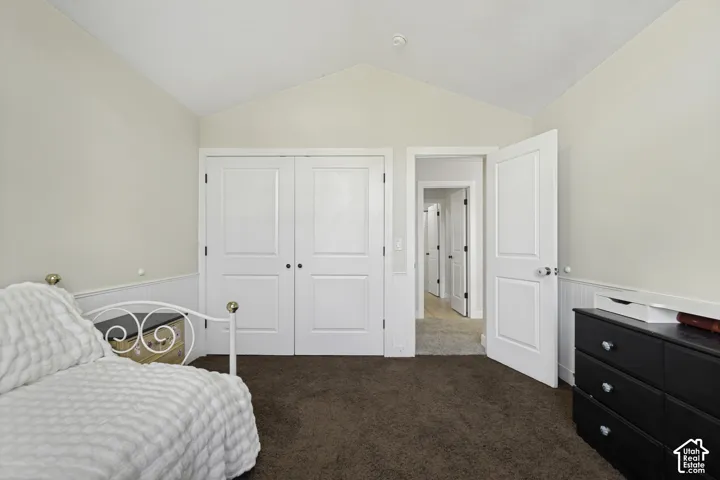 Vaulted ceilings, paneled wainscoting, and double-door reach-in closet
