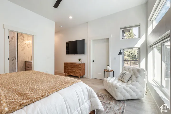 Vaulted ceilings, wood-finish flooring, transom windows, and clean-lined interior doors