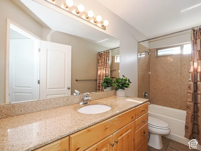 Full Main bathroom, solid counters, marble surround tub/shower