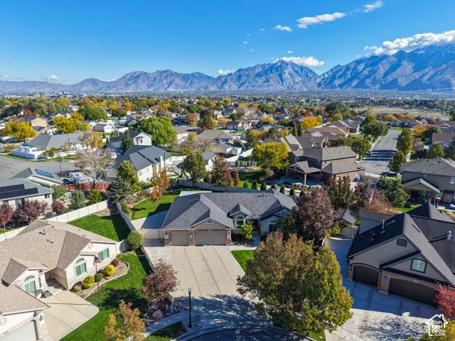 Aerial perspective of a residential property featuring an expansive mountain backdrop