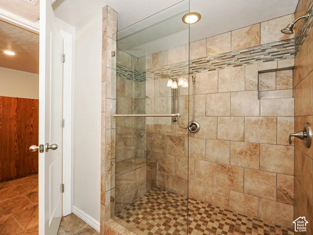 Oversized walk-in tile shower downstairs