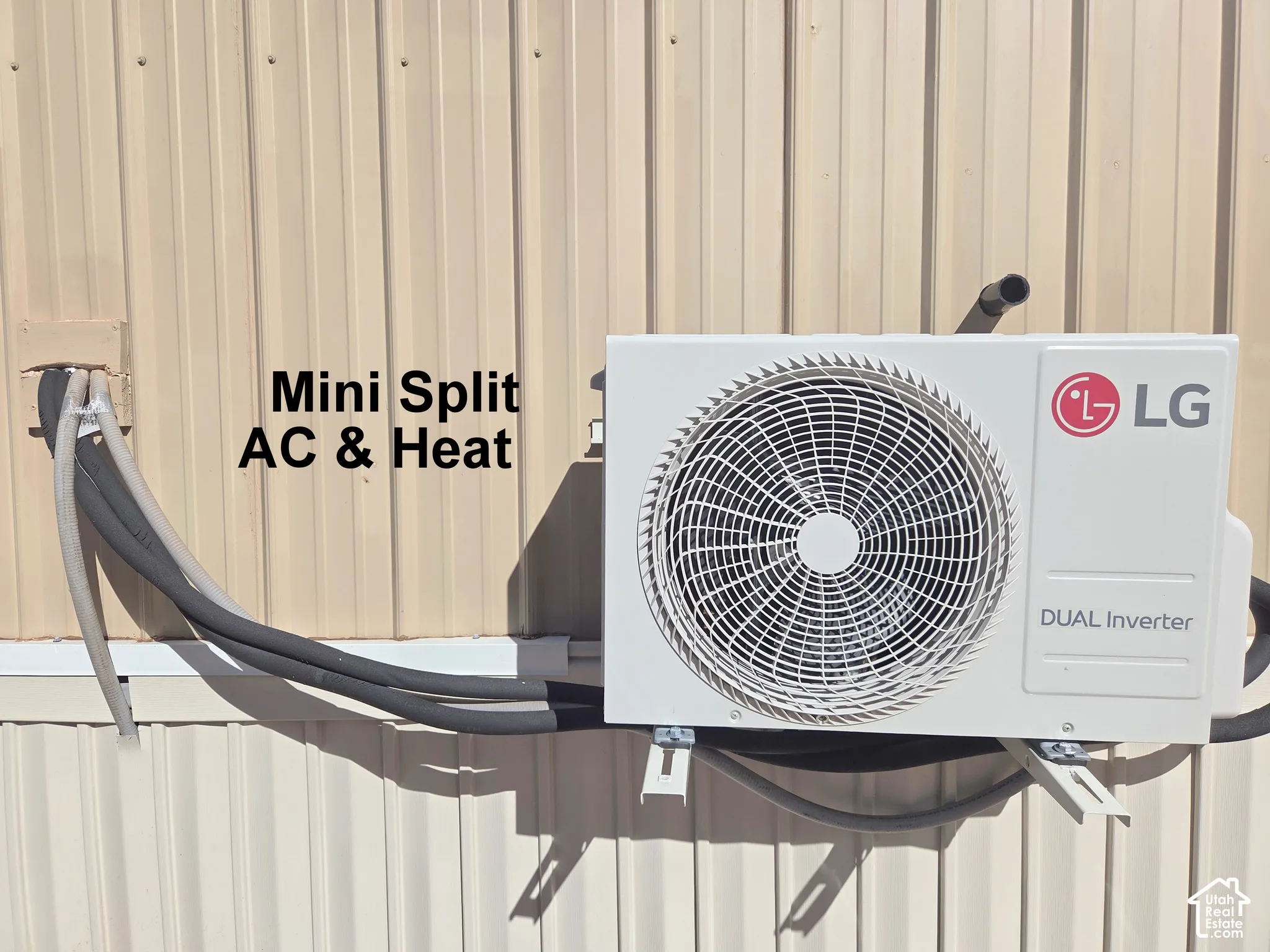 Wall-mounted LG dual-inverter mini-split HVAC system featuring an external condenser unit