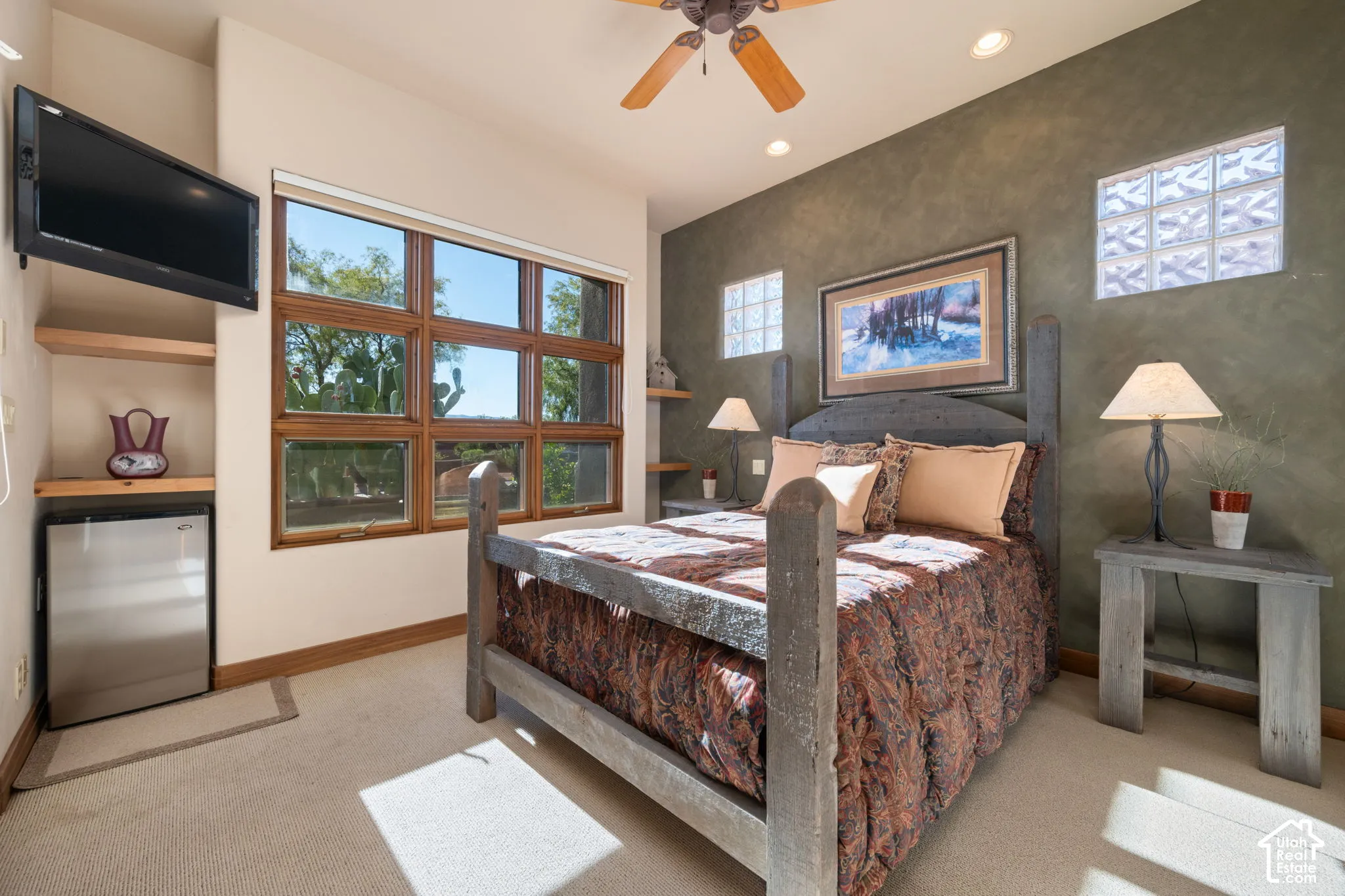 Multi-pane windows, textured accent wall, integrated glass block windows, built-in shelving, and recessed lighting