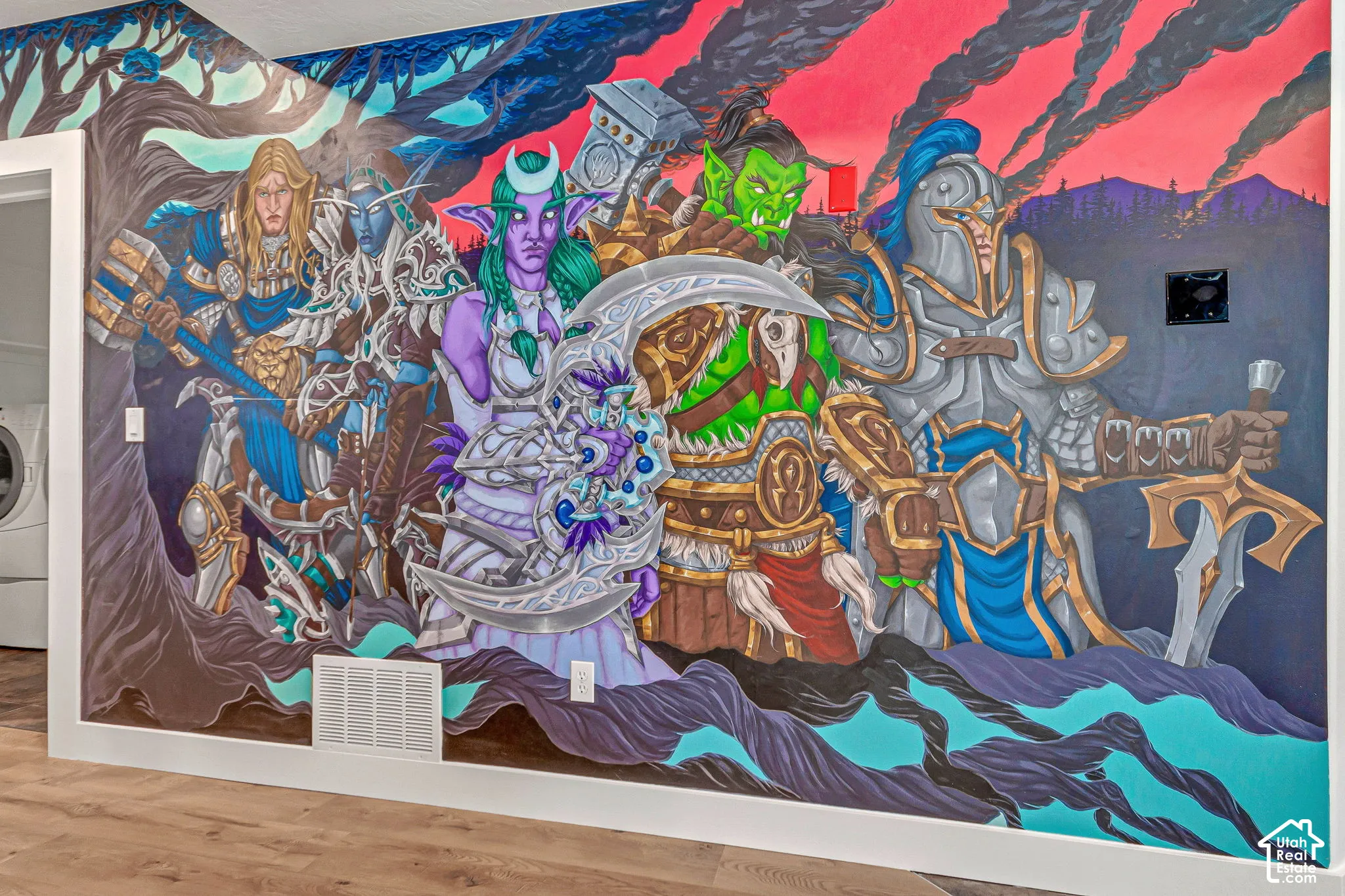 Interior wall featuring a full-scale, multi-colored illustrative mural with wood-finish flooring